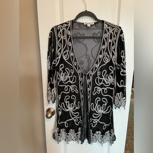 Black , with white embroidery,  cardigan .